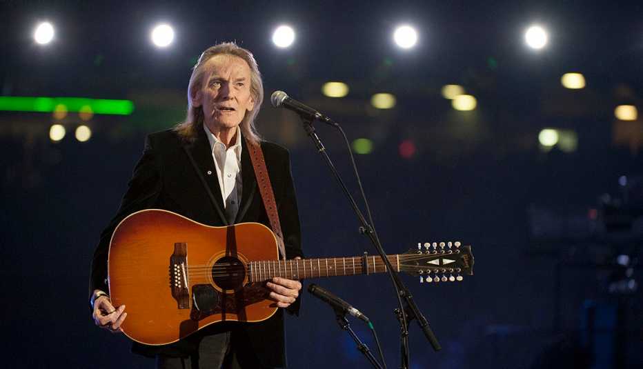 Gordon Lightfoot performing with his acoustic guitar during the CFL's 100th Grey Cup Championship Halftime Show at the Rogers Centre in Toronto