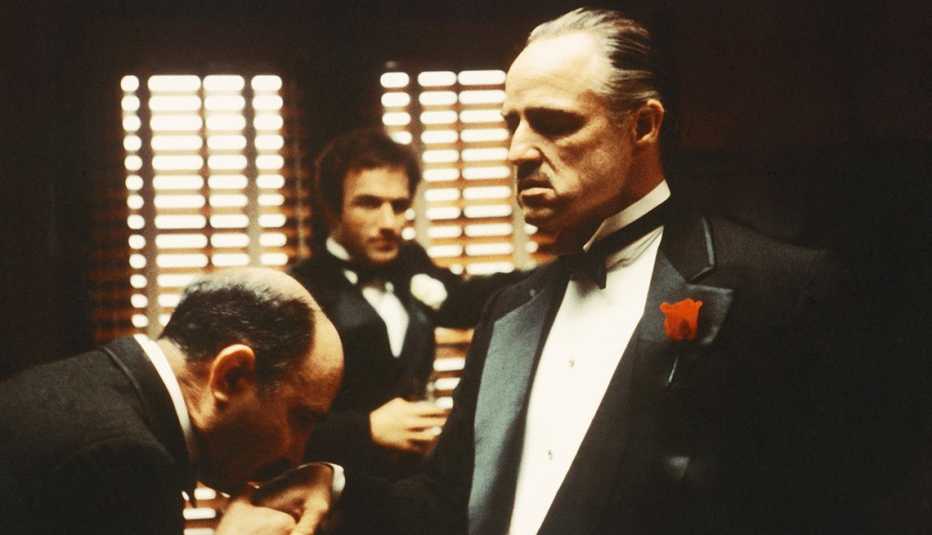 Salvatore Corsitto, James Caan and Marlon Brando in the hand kissing scene from The Godfather