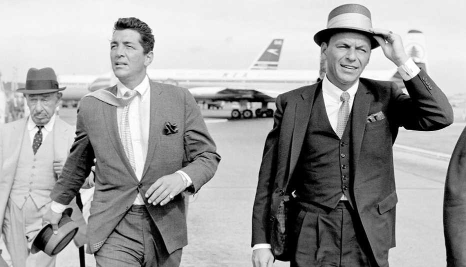 Dean Martin and Frank Sinatra at Heathrow Airport in London