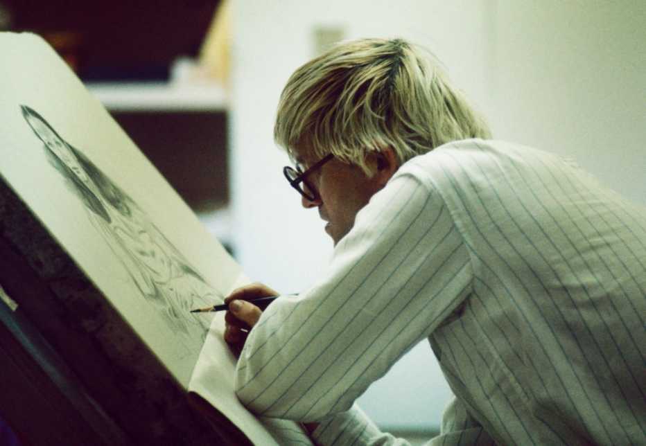 profile view of artist david hockney as he paints at an easel in los angeles california in nineteen sixty five