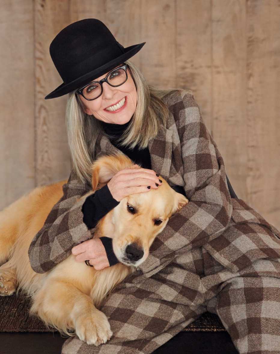 Diane Keaton at home with her golden retriever dog
