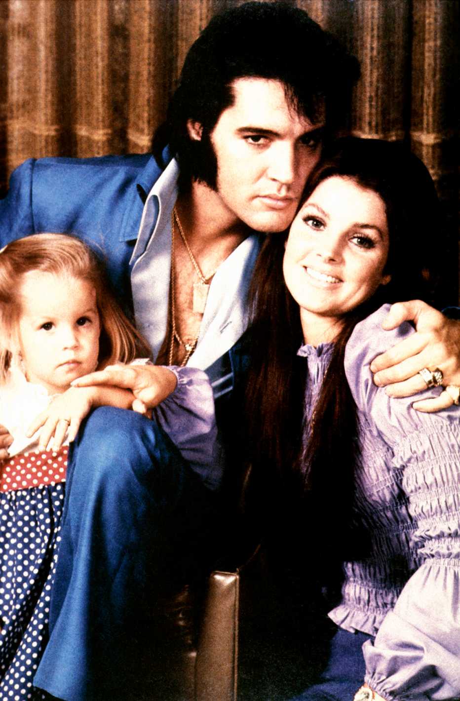 Lisa Marie Presley, Elvis Presley and Priscilla Presley in a photo together