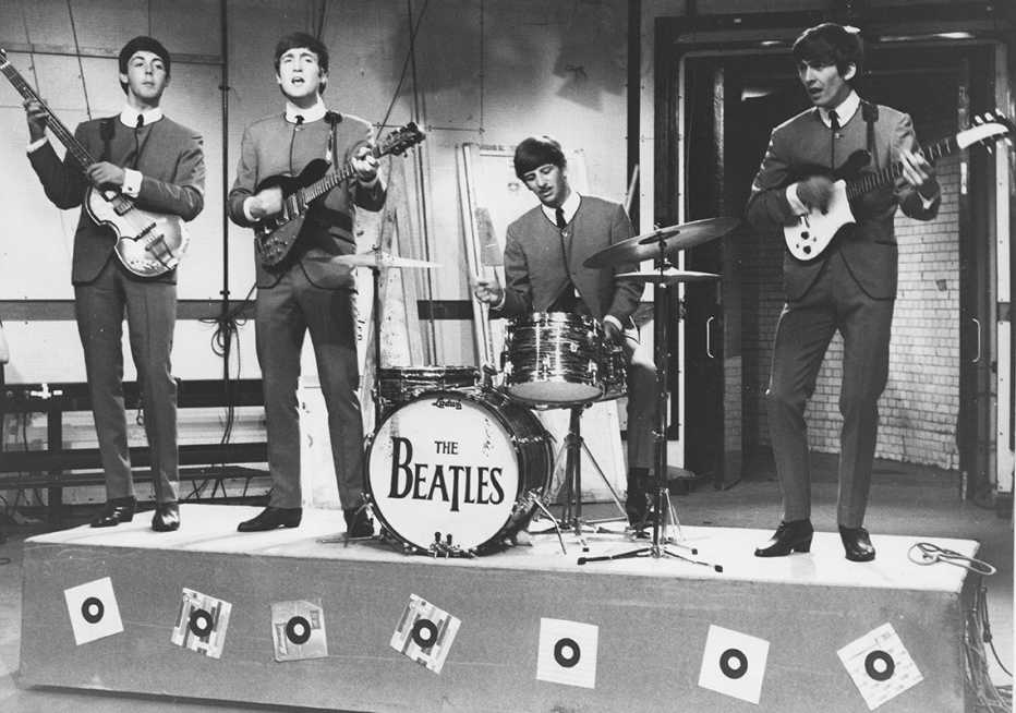 beatles on ready steady go in nineteen sixty three from left to right paul mccartney john lennon ringo starr and george harrison
