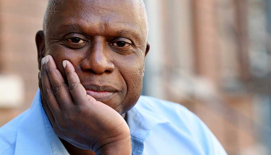 Actor Andre Braugher with his face placed on his right hand posing for a portrait