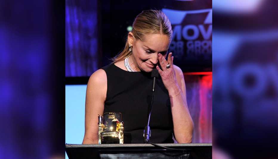 Sharon Stone wipes away tears at AARP Movies for Grownups Awards
