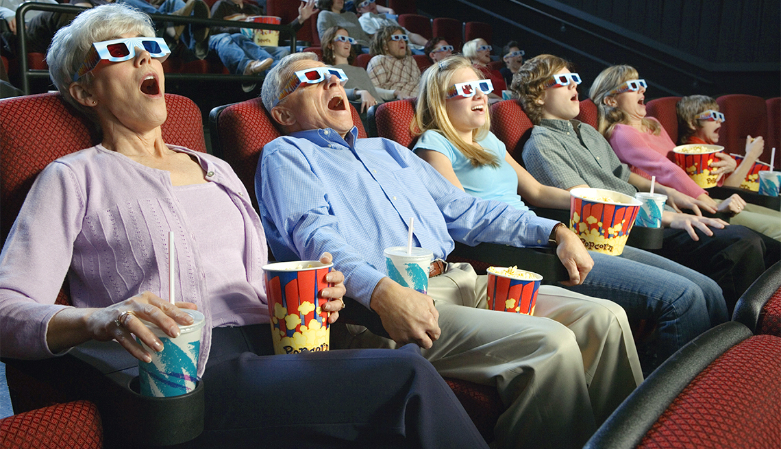 Excited moviegoers watch 3D film