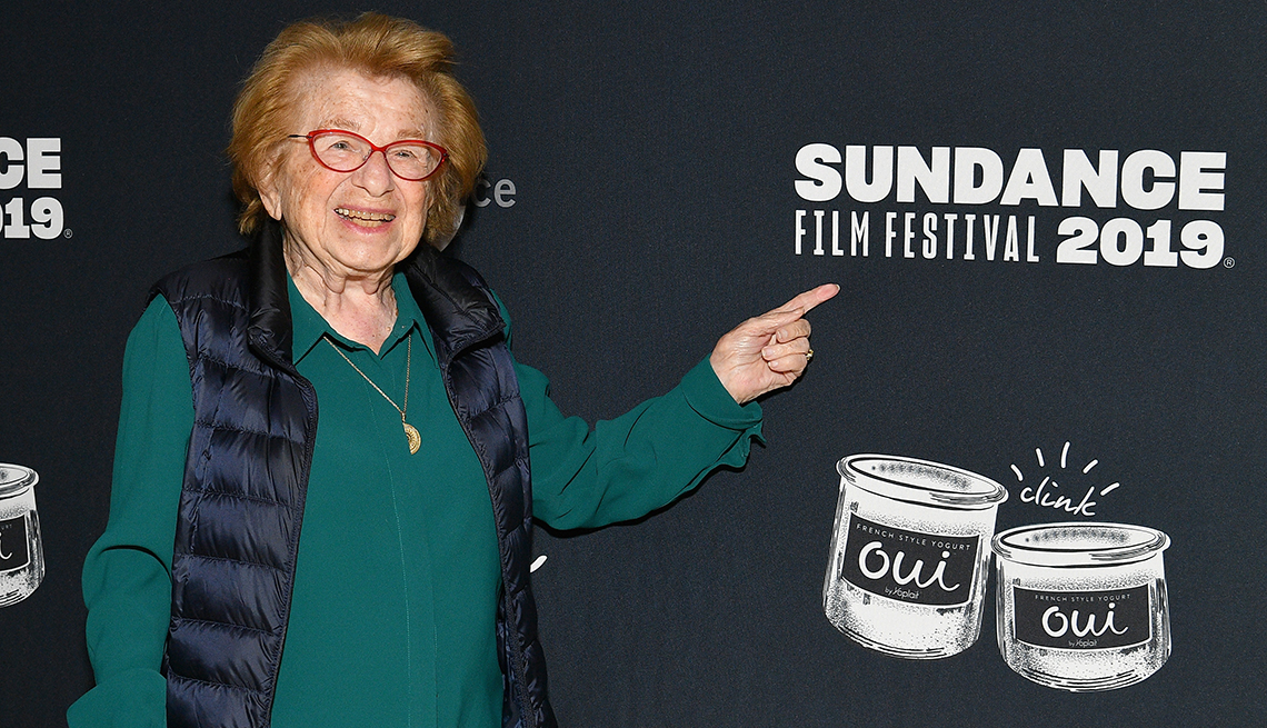 Dr. Ruth points to a Sundance Film Festival 2019 sign