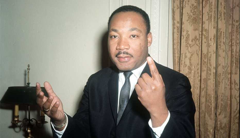 Dr. Martin Luther King, the American Black leader gestures as he carries on an animated conversation during a one-day visit to London 