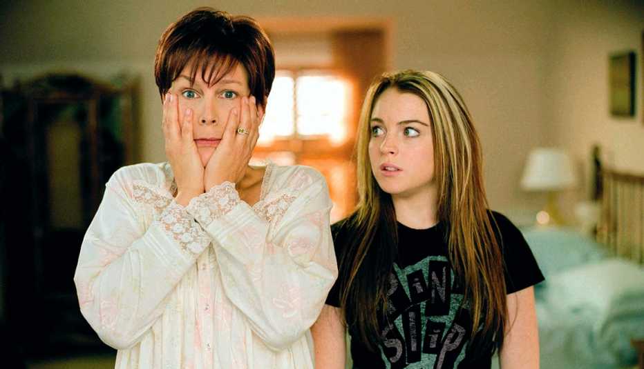 Jamie Lee Curtis places her hands on her face as Lindsay Lohan looks on in Freaky Friday