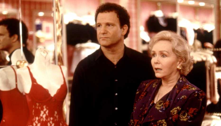 Albert Brooks and Debbie Reynolds in the lingerie section of a store in a scene from the film Mother