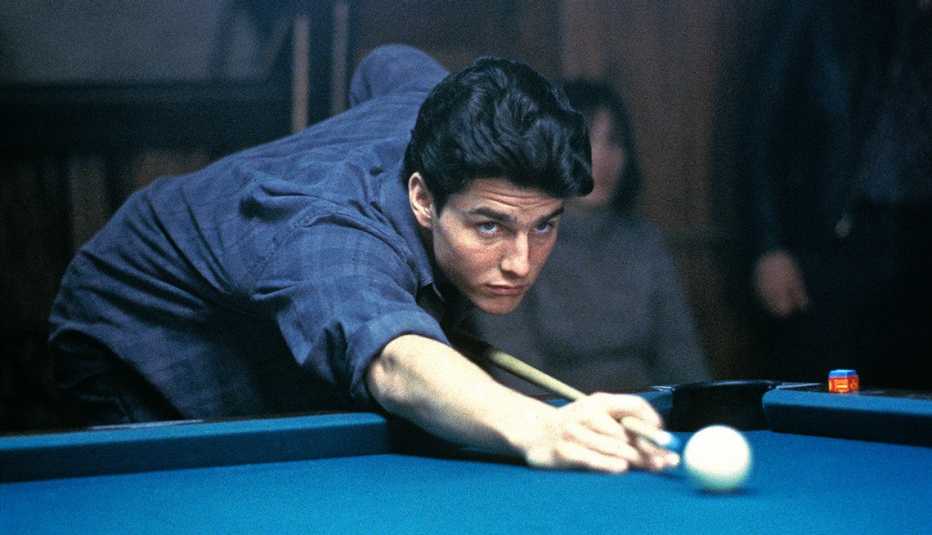 tom cruise shooting a cue ball at a pool table in the film the color of money