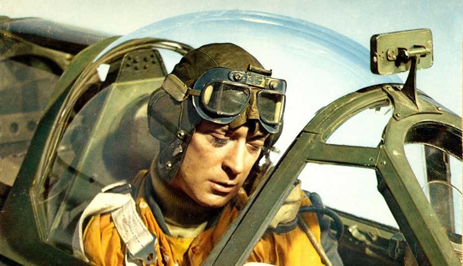 Michael Caine sitting in a cockpit of an aircraft in the film Battle of Britain
