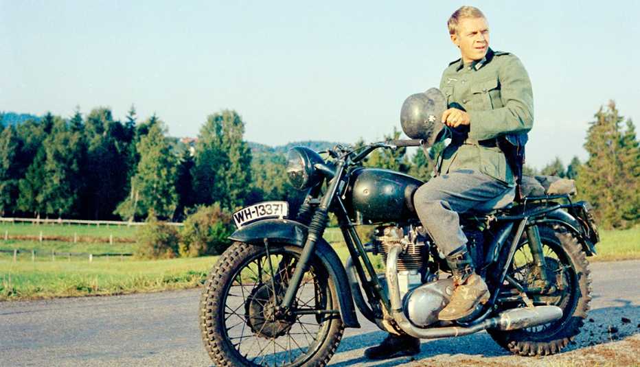 Steve McQueen sitting on a motorcycle for the film The Great Escape