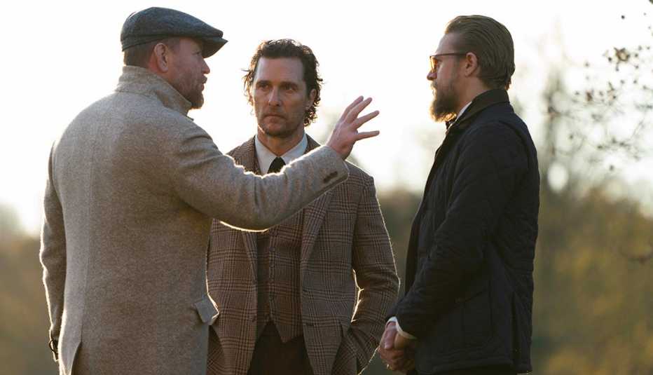 Director Guy Ritchie and actors Matthew McConaughey and Charlie Hunnam on set of the film The Gentleman