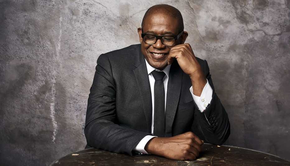 Actor Forest Whitaker in a black suit, black tie and white shirt