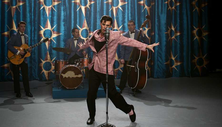 Austin Butler performing in front of a band in a scene from the film Elvis