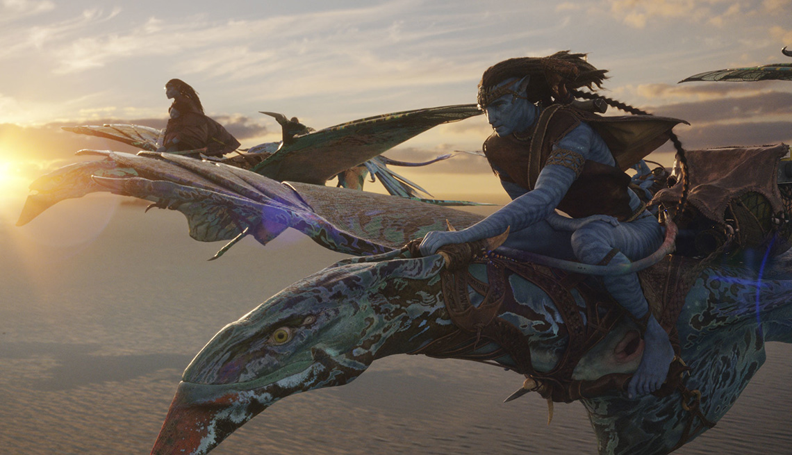 Neytiri and Jake Sully riding on flying creatures in the film Avatar: The Way of Water