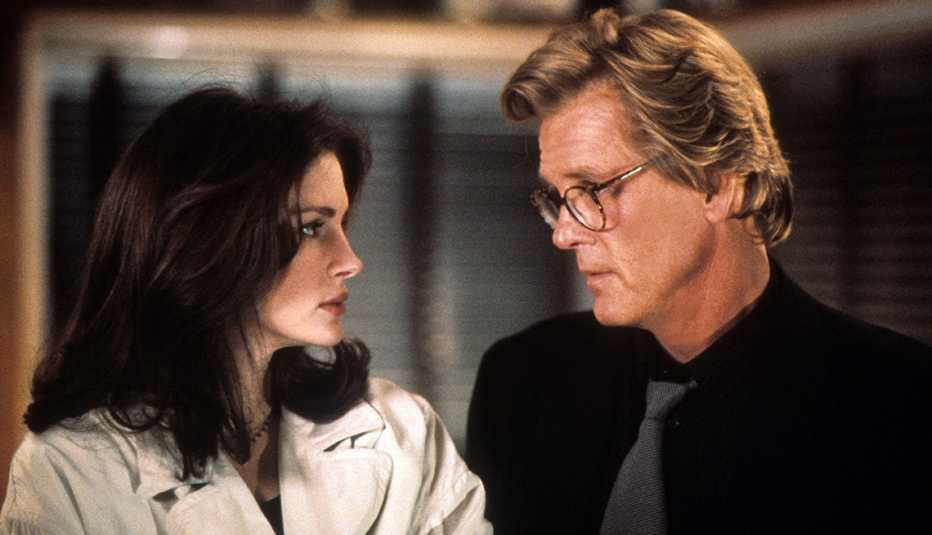 Julia Roberts and Nick Nolte looking at each other in the film I Love Trouble