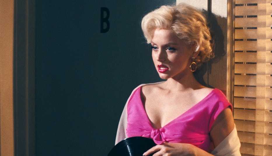 Ana de Armas wearing a pink dress as she stars as Marilyn Monroe in the Netflix movie Blonde