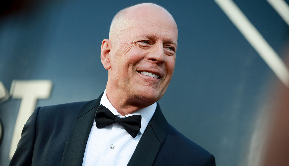 Bruce Willis wearing a tuxedo on the red carpet at the Comedy Central Roast of Bruce Willis