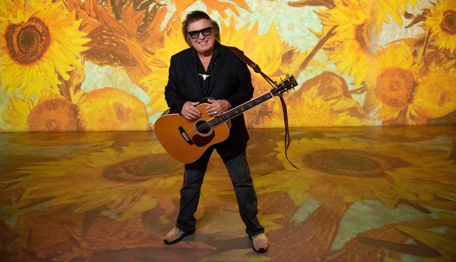 Don McLean with his acoustic guitar during a performance at Immersive Van Gogh in Los Angeles California
