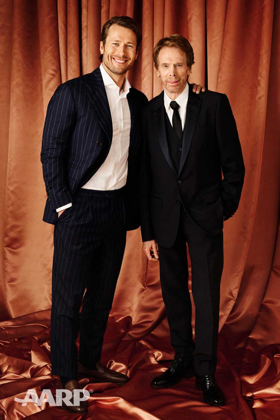 Glen Powell and Jerry Bruckheimer pose for a portrait at the AARP Movies for Grownups Awards