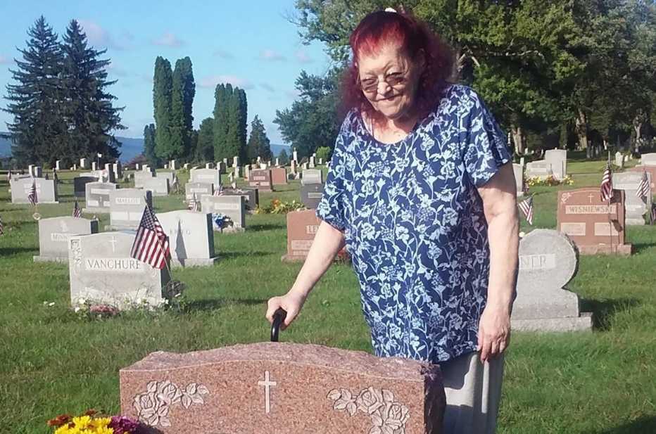 Bobbi Dempsey's mother Marcelle visiting her feather's grave at cemetery