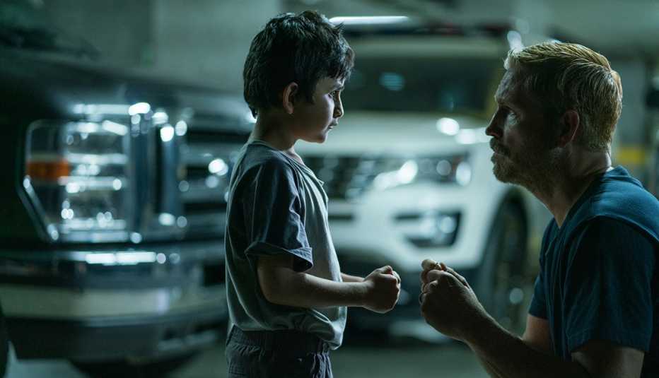 jim caviezel fist bumps a young boy in a scene from the film sound of freedom