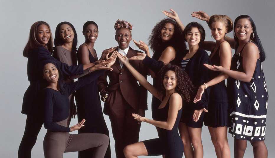 A group of women surround Bethann Hardison in the documentary Invisible Beauty