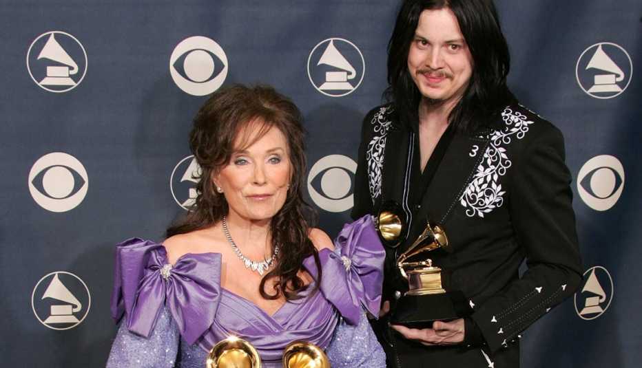 Loretta Lynn and Jack White pose backstage with their awards for 'Best Country Collaboration With Vocals' during the 47th Annual Grammy Awards at the Staples Center February 13, 2005 in Los Angeles, California.