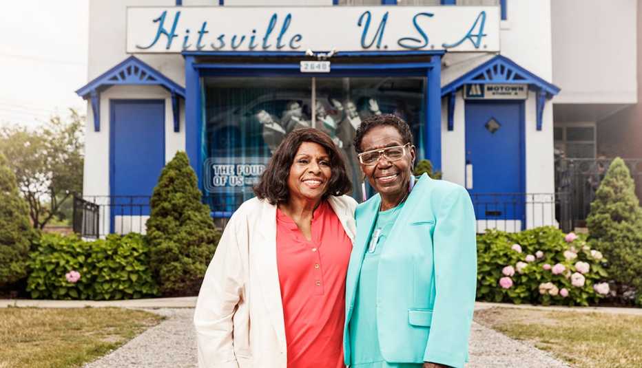 Louvain Demps and Jacqueline Hicks in front of Hitsville U.S.A. building.