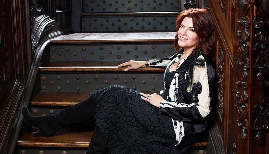 Rosanne Cash, sitting on stairs