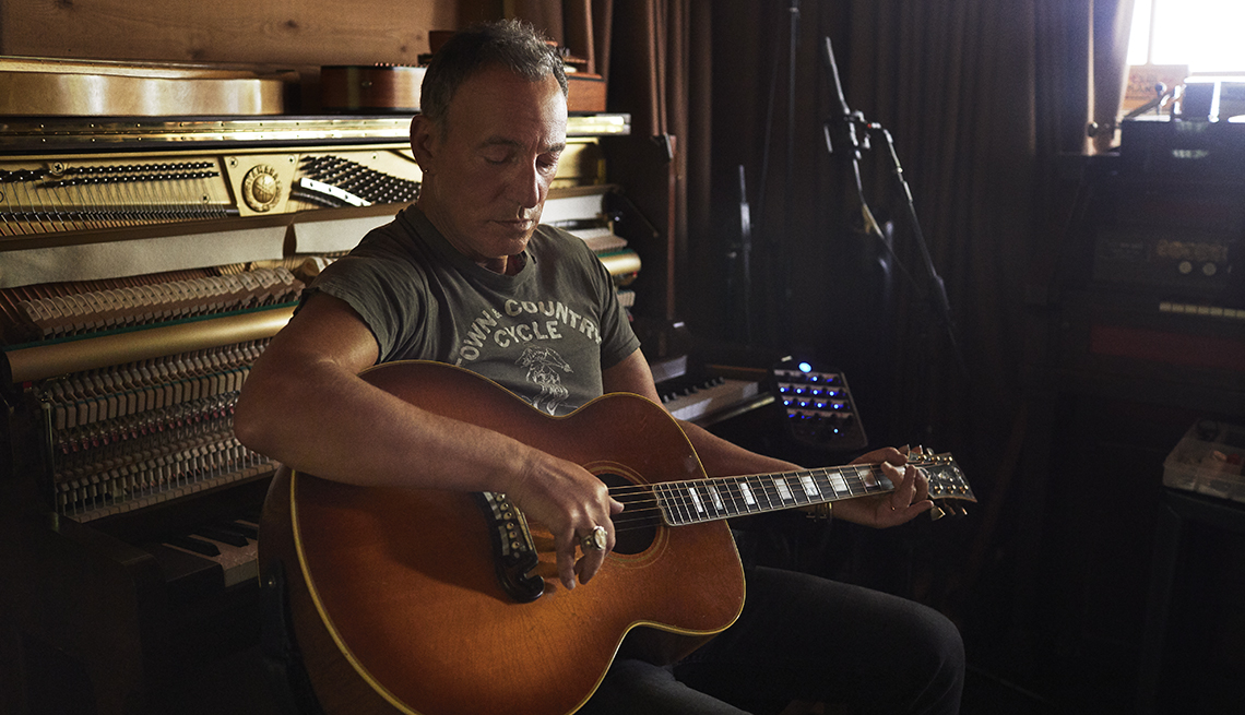 bruce springsteen at home playing guitar