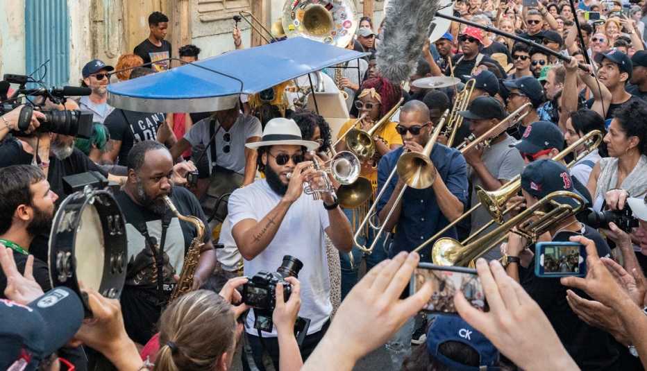 erion williams julian gosin and troy trombone shorty andrews in a conga line with cuban band cimafunk in havana cuba