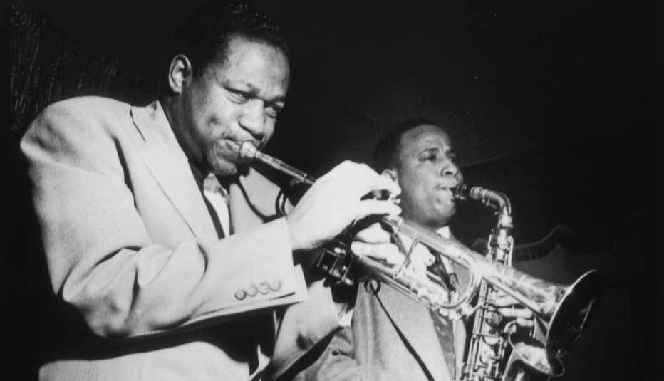 american jazz musicians clifford brown and lou donaldson performing on stage with a trumpet and an alto saxophone
