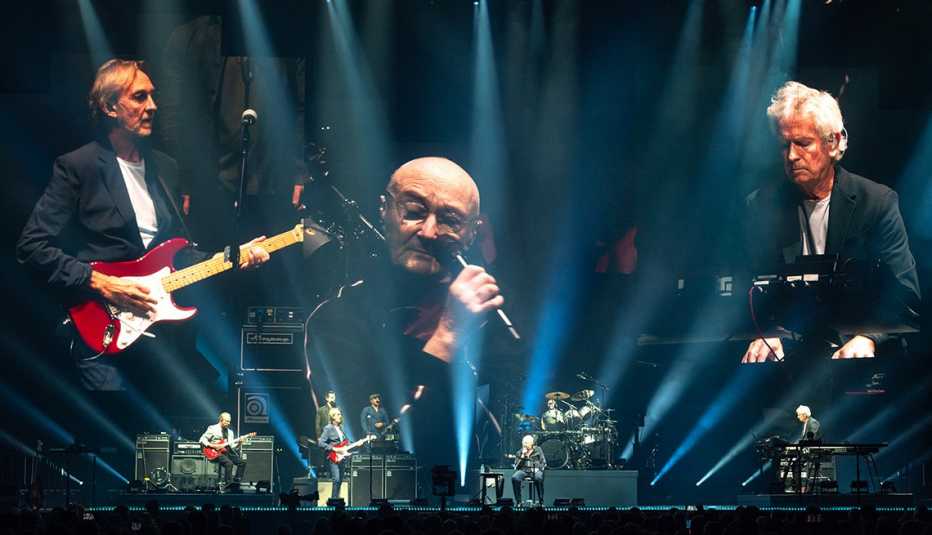 Genesis performs on stage for The Last Domino Tour