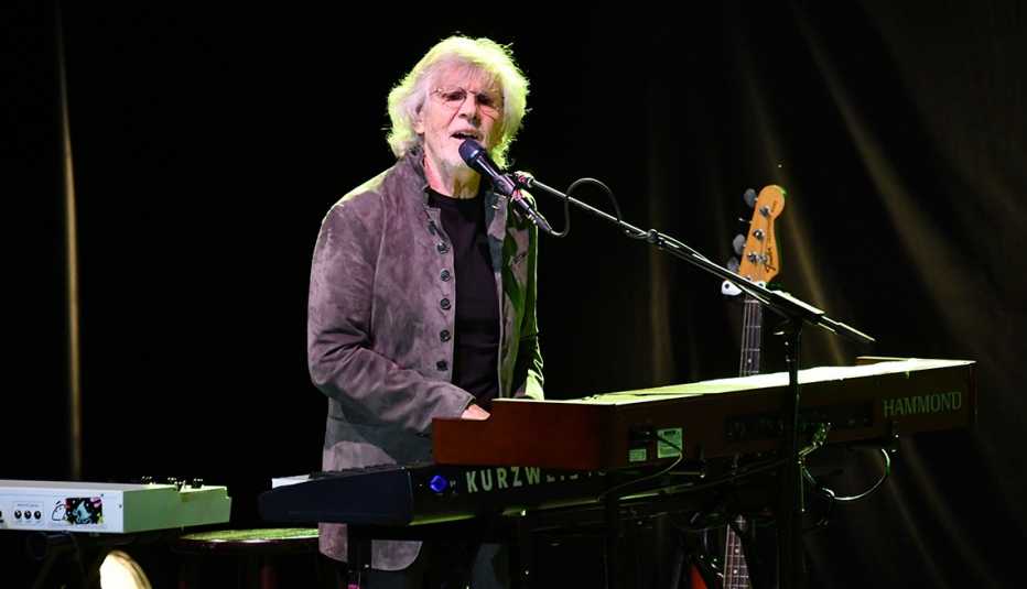 rod argent of the zombies shown playing keyboards and singing
