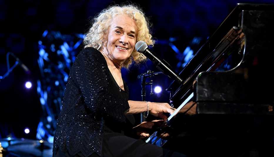 Carole King performs on the piano onstage during the 36th Annual Rock and Roll Hall of Fame Induction Ceremony