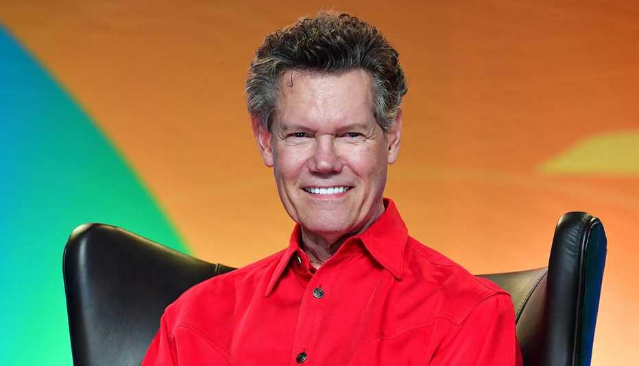Randy Travis sitting onstage at the Jesus Calling Presents Conversations with Randy and Mary Travis and Ken Abraham at Music City Center during the 2019 CMA Music Festival