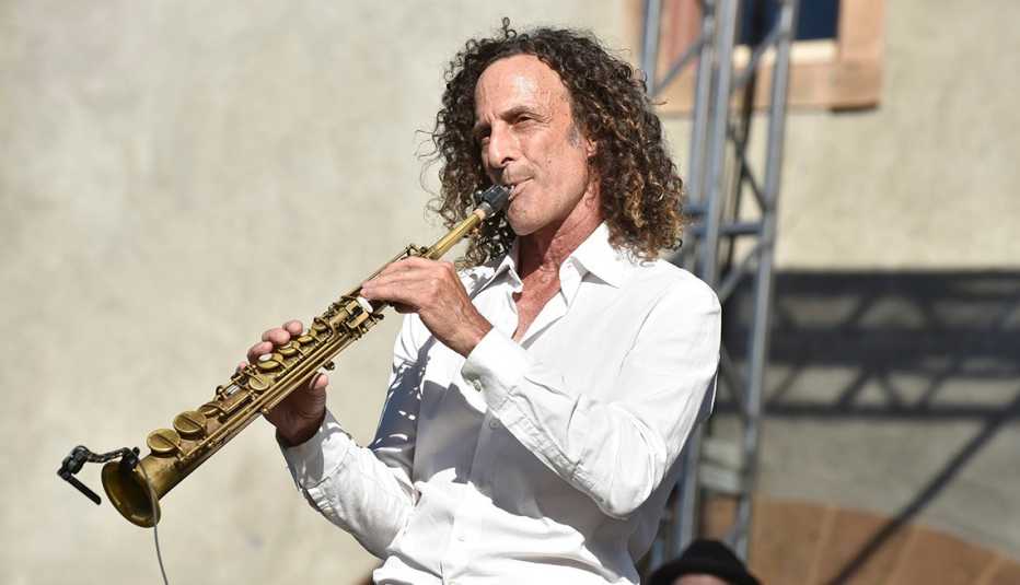Kenny G performing with his saxophone
