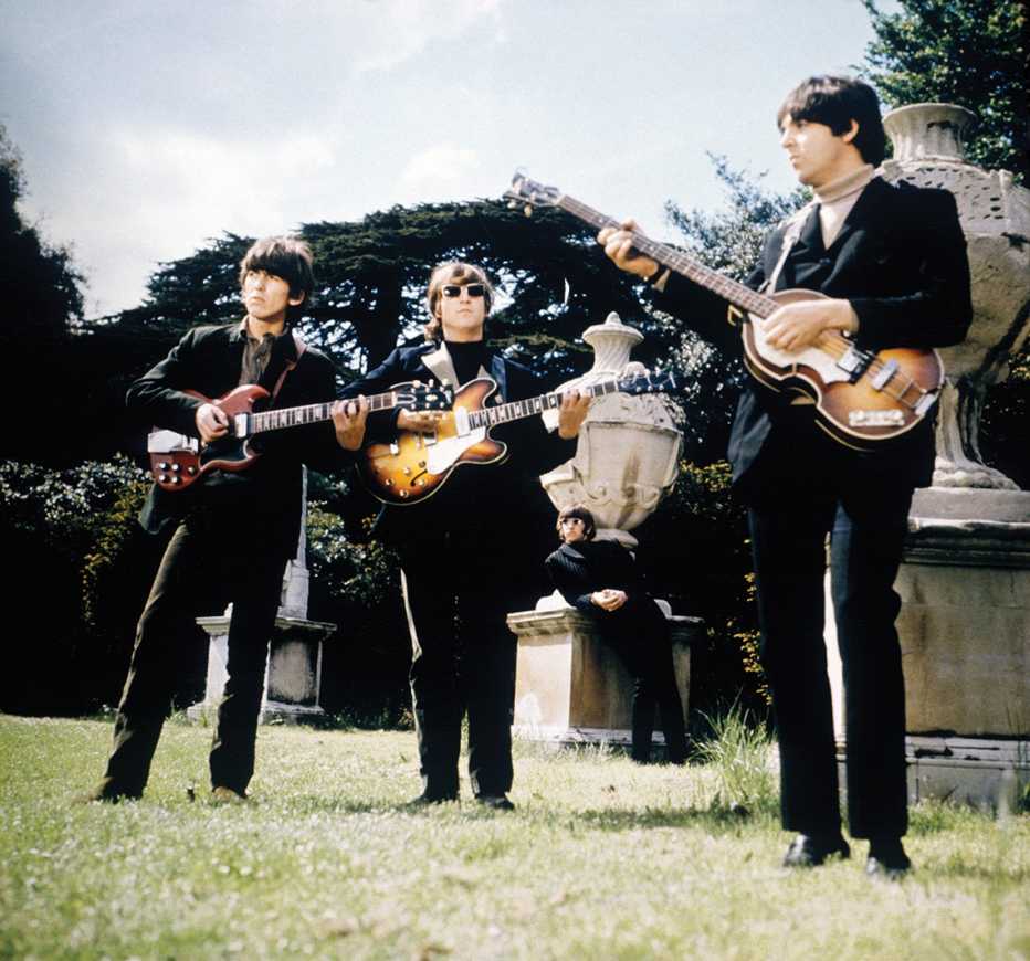 The Beatles with their instruments filming promotional films at Chiswick House in London in 1966