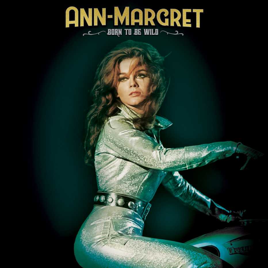 Ann Margret in a silver jumpsuit riding a motorcycle for the album cover for Ann Margret's Born to Be Wild