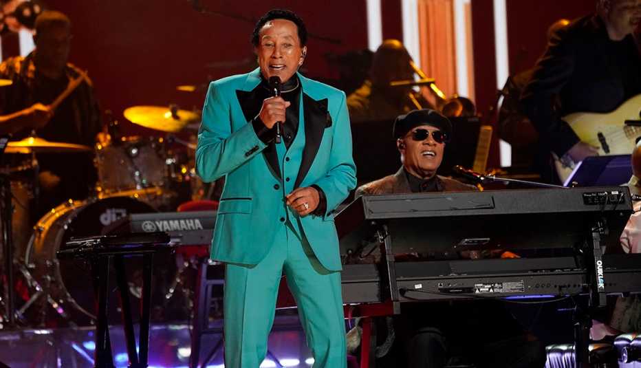 Smokey Robinson and Stevie Wonder perform onstage at the 65th Grammy Awards