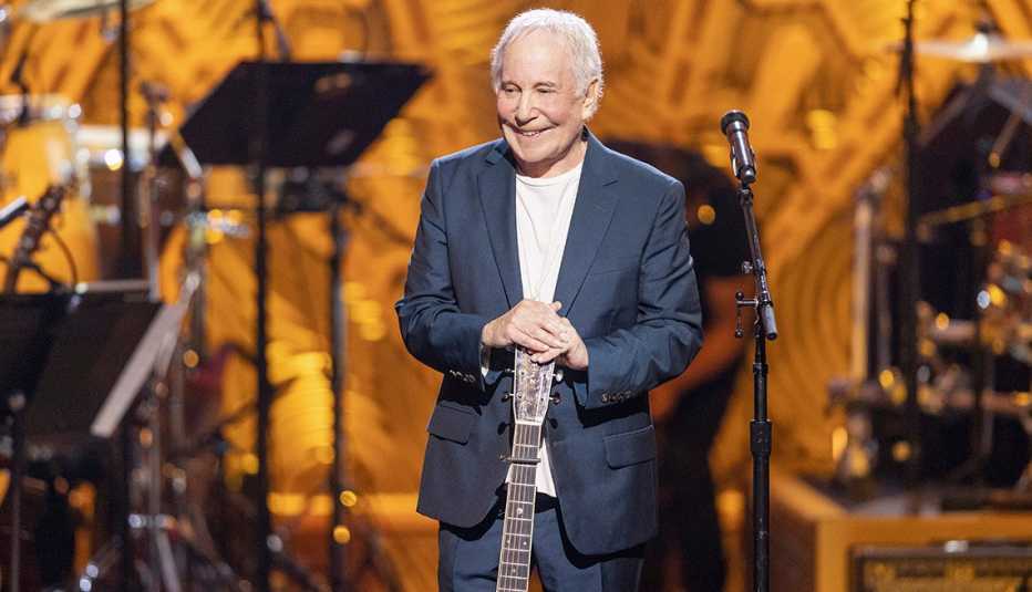 Paul Simon makes a special appearance onstage with his guitar during the special tribute concert Homeward Bound: A Grammy Salute to the Songs of Paul Simon