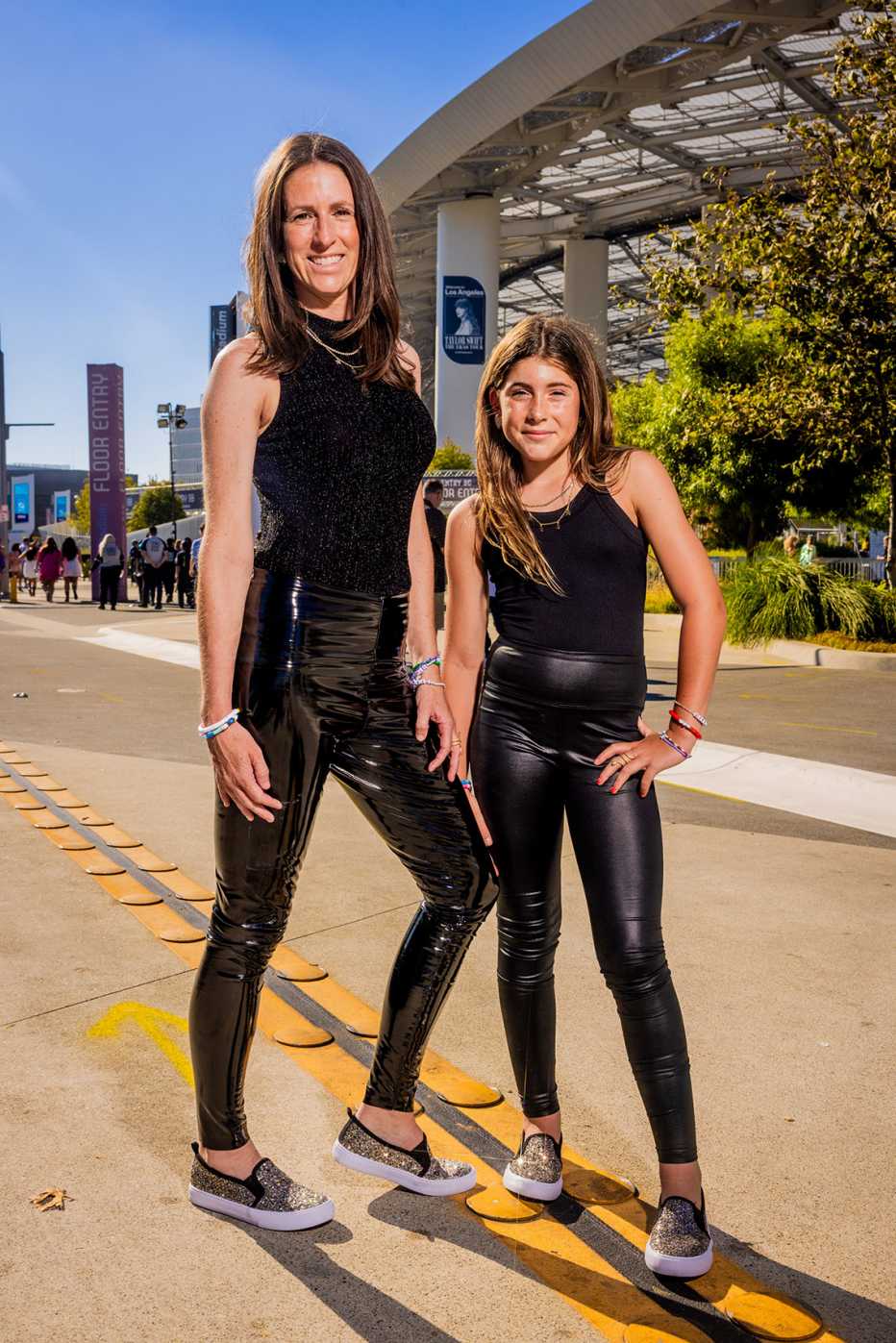 megan parma and daughter kennedy parma in all black outfits posing outside of sofi stadium in los angeles california