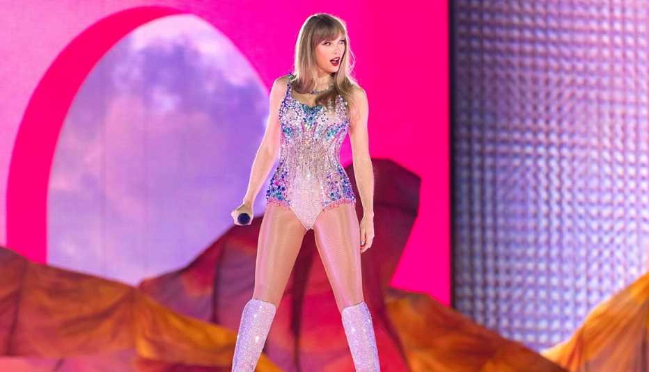 taylor swift performing onstage during her the eras tour at allegiant stadium in las vegas