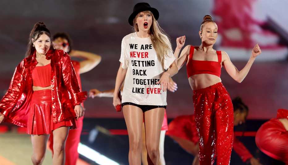 Taylor Swift performing onstage with her dancers during a concert at AT&T Stadium in Arlington, Texas