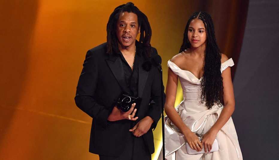 Jay-Z accepts the Dr. Dre Global Impact Award alongside his daughter Blue Ivy at the 66th Annual Grammy Awards