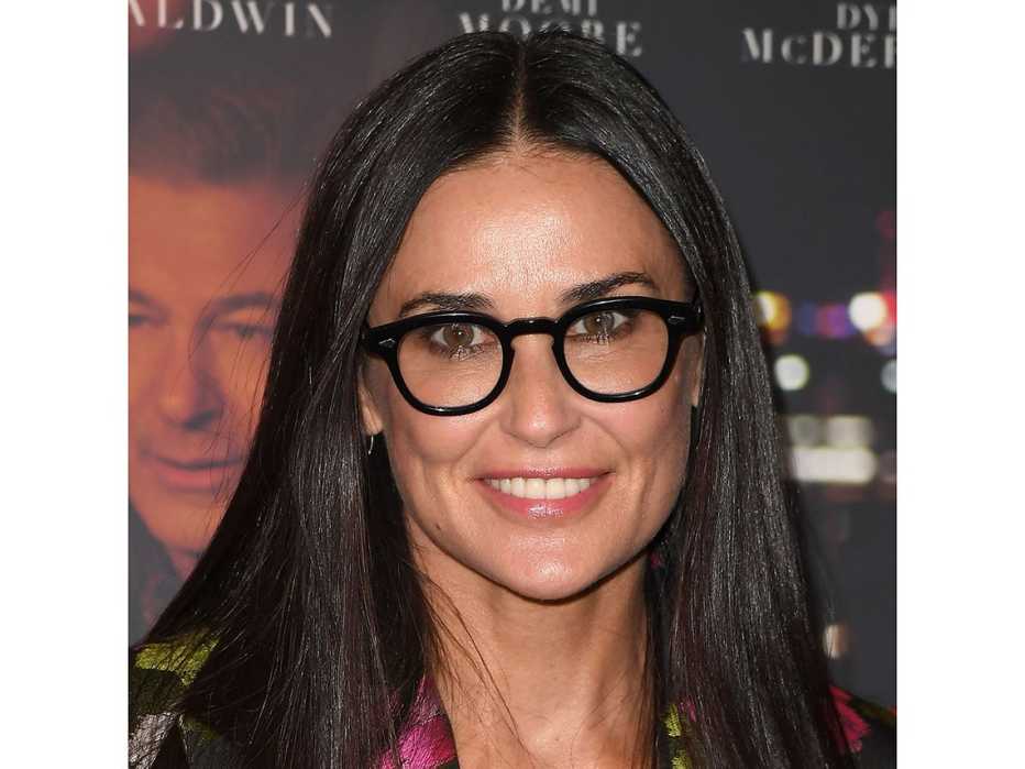 Demi Moore with black frame glasses.