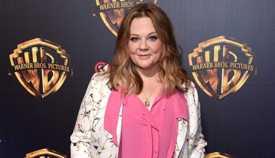 Actress Melissa McCarthy in a pink shirt and floral blazer